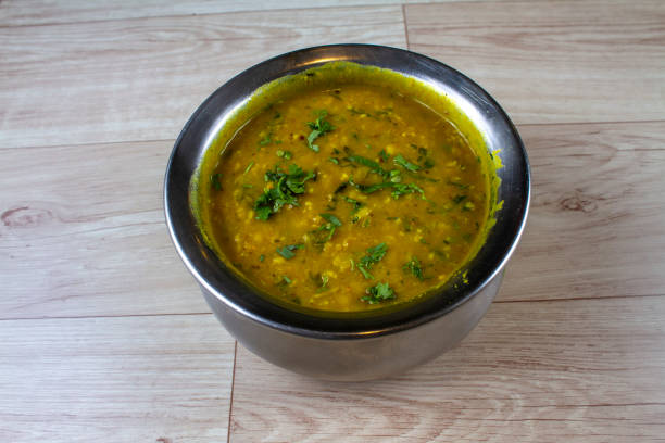 istock dalimbi usal Maharashtrian popular nutritious breakfast, isolated over a rustic wooden background, selective focus 2168833691