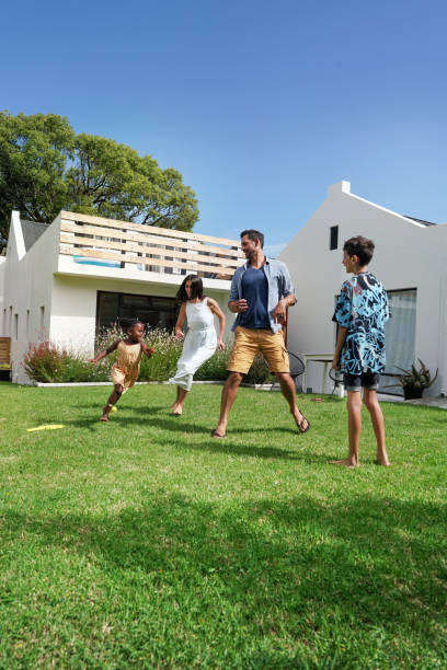 istock Parents with children (6-7, 8-9) playing on back yard 2168835980
