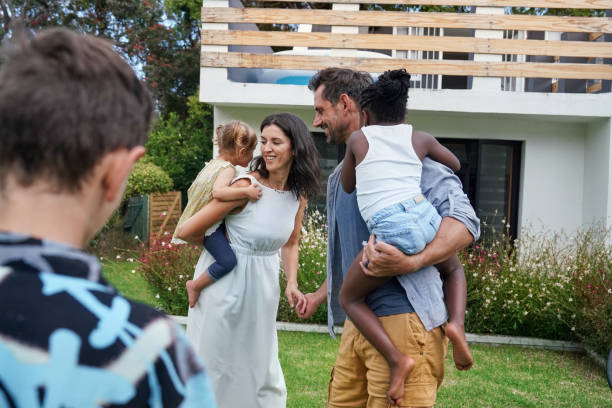 istock Parents with children (18-22 months, 6-7, 8-9) playing on back yard 2168836133