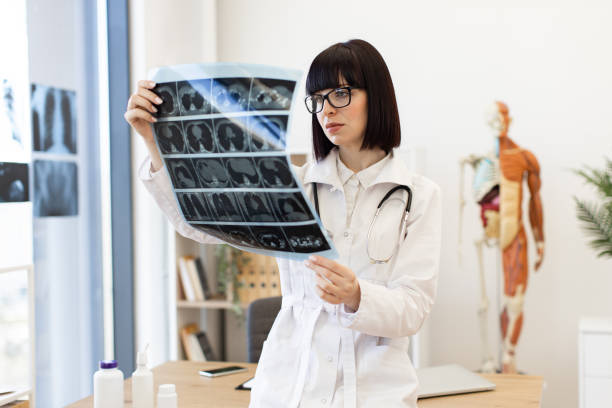 istock Doctor analyzing x-ray in modern medical office 2168839395