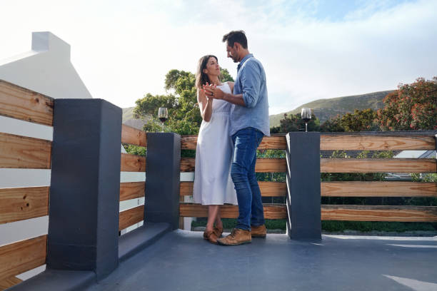 istock Couple embracing on terrace 2168839427