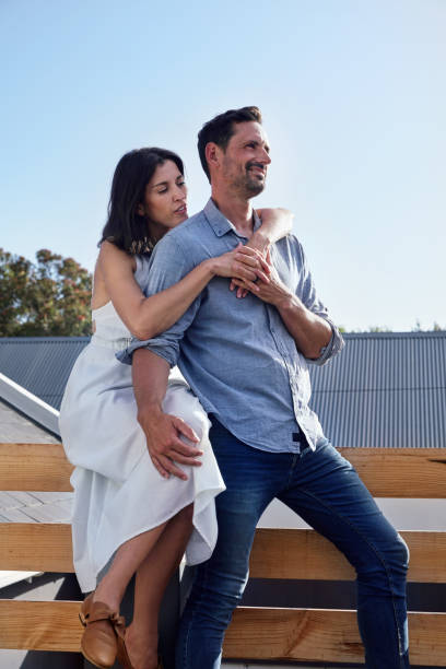 istock Couple embracing on terrace 2168839513