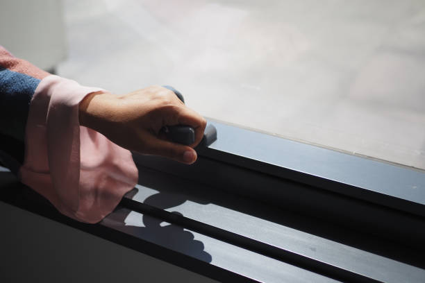 istock hand open gray plastic pvc window at home at early morning 2168839780