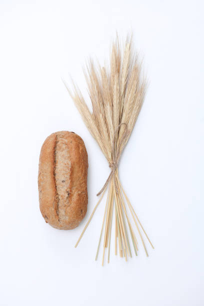 istock Appetizing rye bun with rye spikelets on a white background 2168841912