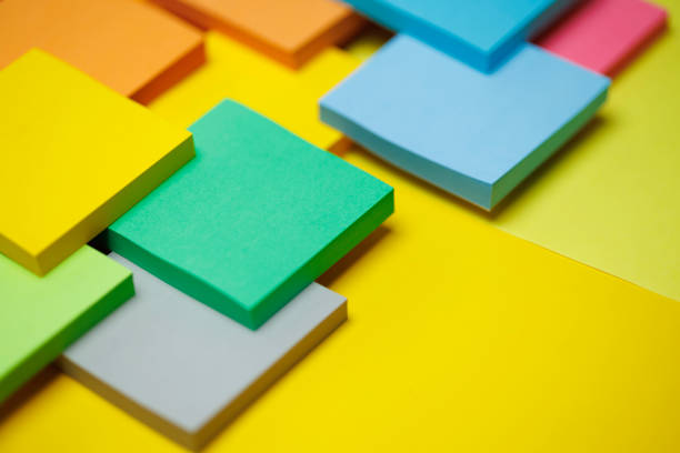 Top view of yellow sticky note paper or post-it on white background