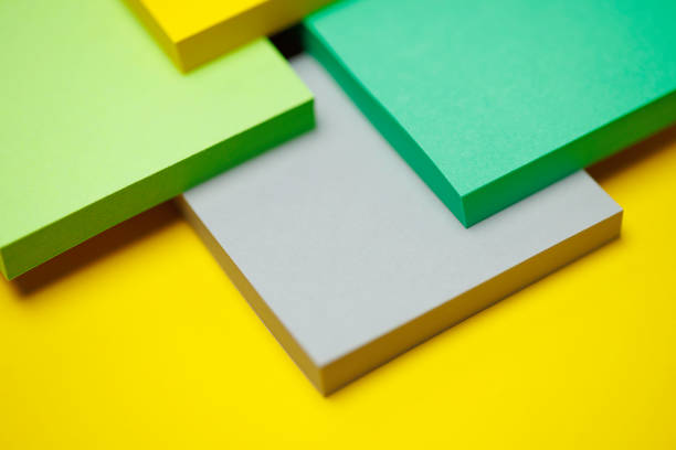 a stack of coloured pads with sticky notes