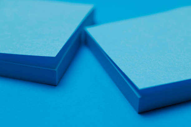 A dog-eared page in opened book on white table