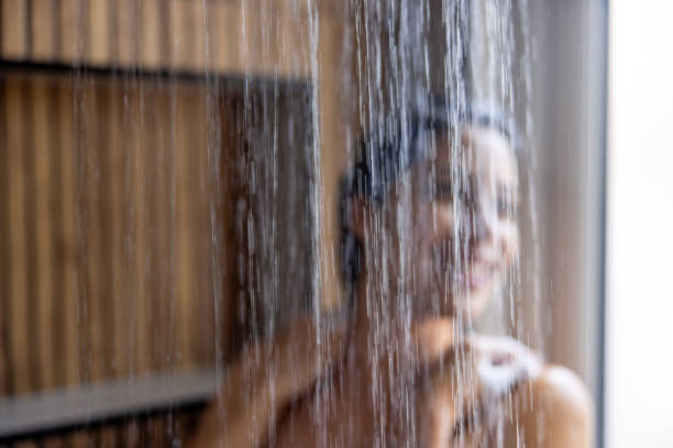 Woman taking a shower in the bathroom