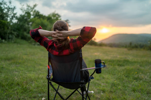 istock Beautiful woman relaxing on camping trip 2168843733