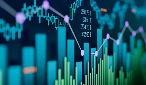 Close-up of charts, bar graph and business data.