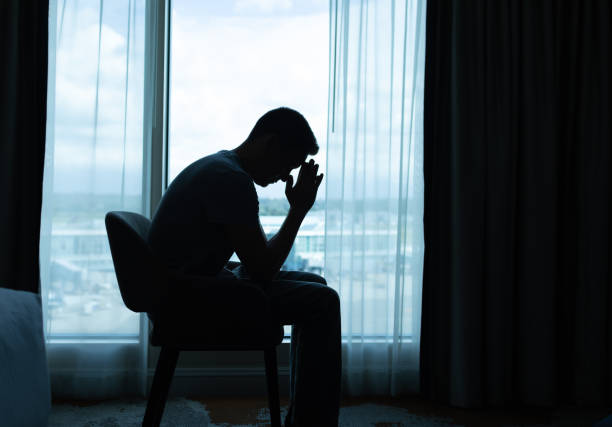 istock Man sitting in the  room and pray. 2168846208