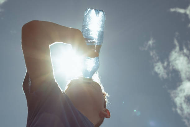 istock Little boy hydrating during hot summer day. 2168846520