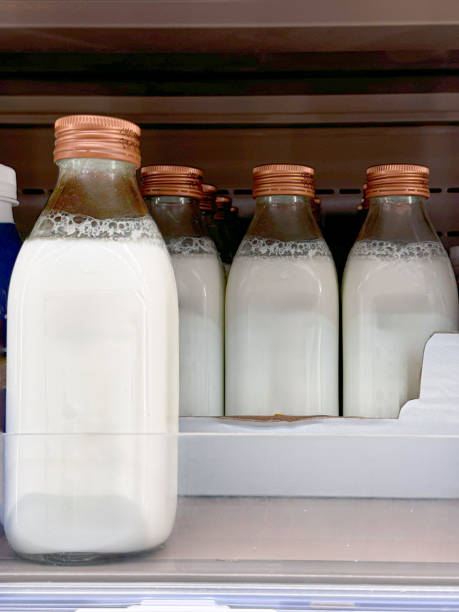 istock Glass Bottles Filled with Milk 2168850461