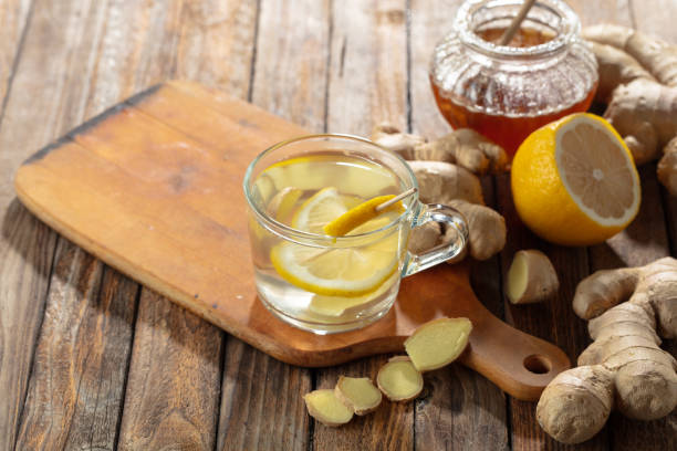 istock Ginger tea with lemon and honey on a old wooden table. 2168853315