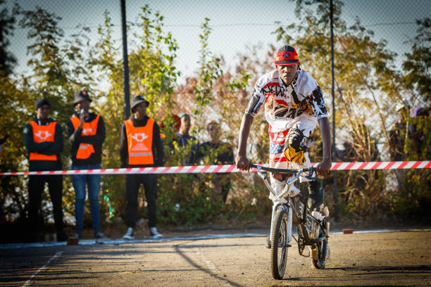 Cyclist shows his tricks with his recycled bicycle. A parade and various art performances were held to promote and celebrate recycling towards saving the environment for future generations.