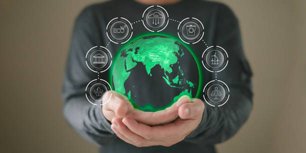 istock hand hold hologram to save energy,and reduce global warming,climate change,ecology friendly investment,ESG environment social governance,Green Business Innovation and Sustainable Development concept. 2168857457