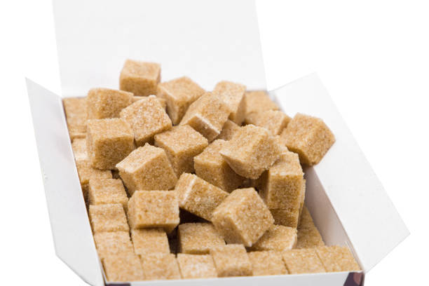Brown sugar cubes in a box.