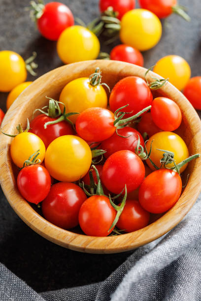 istock Different colorful cherry tomatoes in bowl. 2168858840