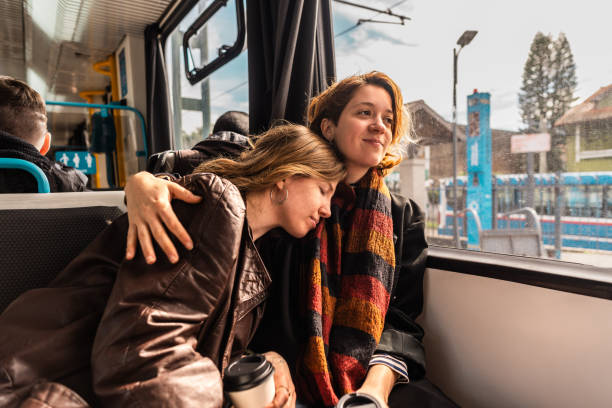 istock Lesbian couple embracing in the subway train 2168864968