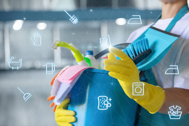 istock A cleaning lady clicks on cleaning icons on the web. 2168865002