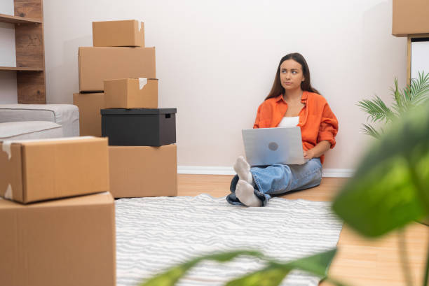 istock Young female thinks about moving to new modern apartment 2168866296