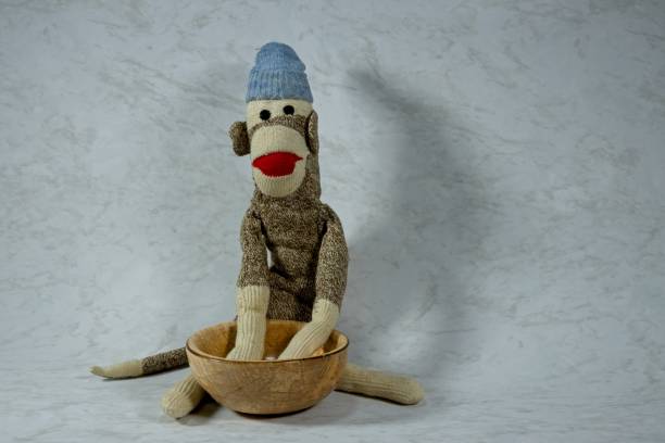 istock Sock Monkey with Wooden Bowls 0744 2168866516