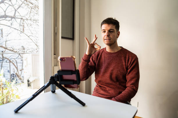 istock Teacher speaking in sign language with student on a video call at remote lesson 2168866589