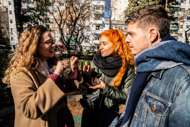 istock Deaf friends speaking in sign language outdoors 2168867708