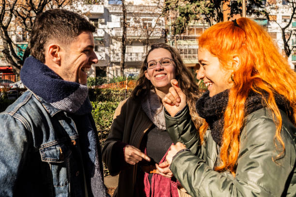istock Deaf friends speaking in sign language outdoors 2168867710