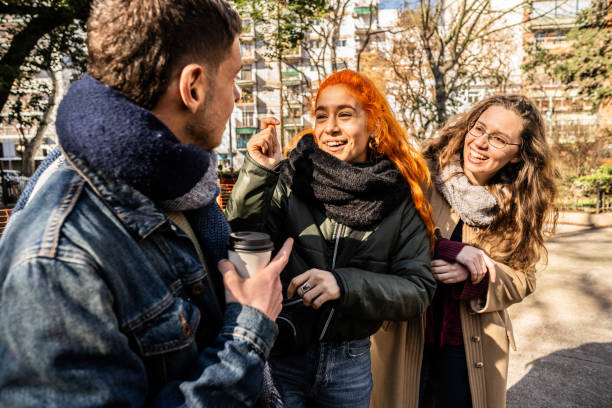 istock Deaf friends speaking in sign language outdoors 2168867711