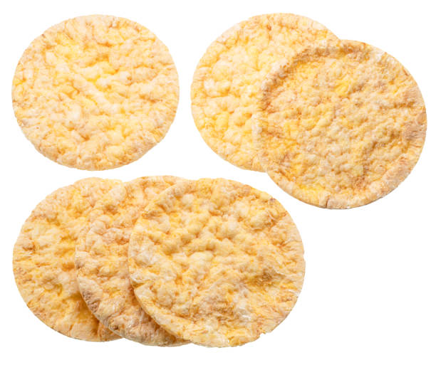 Puffed corn cakes or rice cakes on white. Alternative snack for bread product.Top view. File contains clipping paths.