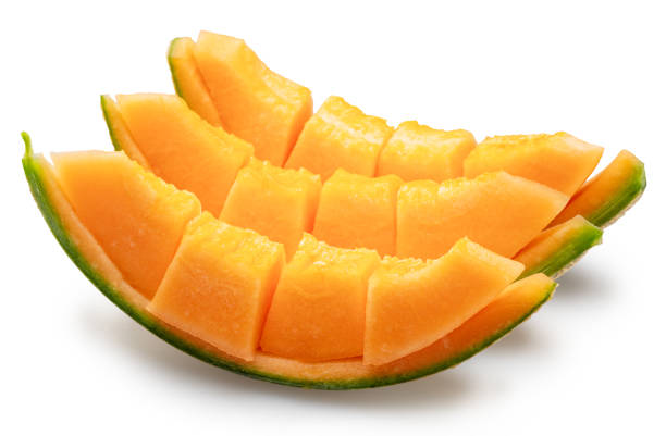 Cantaloupe melon slices isolated on white background. File contains clipping path.