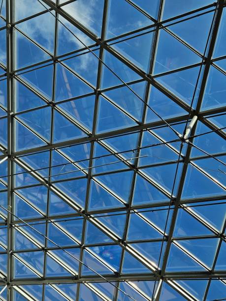 istock Modern Glass Ceiling with Metal Framework against Clear Blue Sky 2168873256
