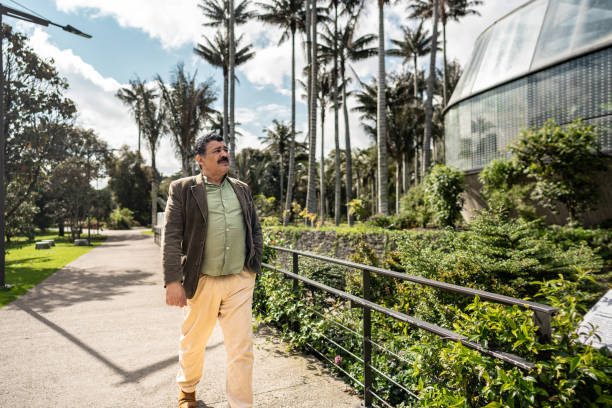 istock Senior man walking through the botanical garden 2168874829