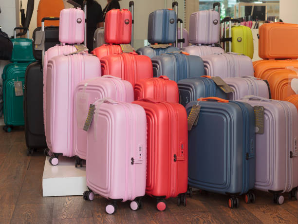 istock An array of colorful suitcases lined up for sale 2168874938