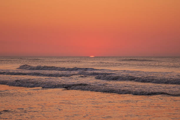 Ocean waves at sunrise off the beach on the Jersey Shore