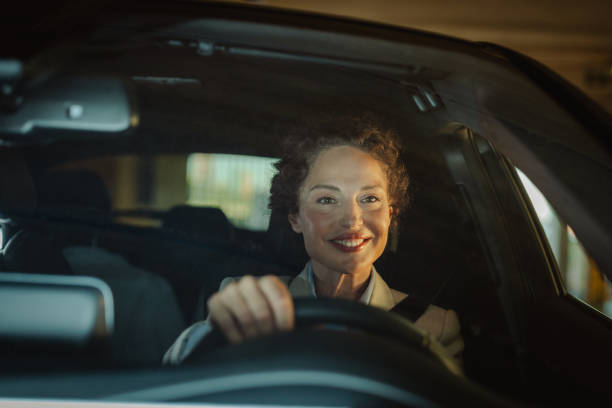 istock Woman smiling while confidently driving a car 2168881165