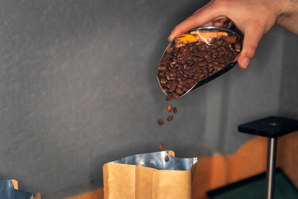 istock The man is packaging roasted coffees ready for sale. 2168884529