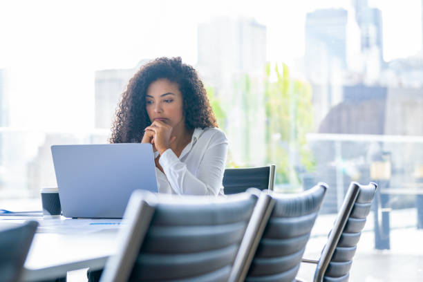 istock Upset woman working on a laptop computer in the office. 2168888740