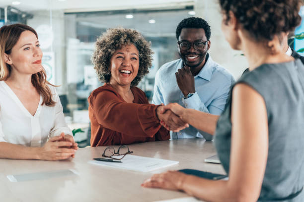 istock Shaking hands with new colleague 2168892131