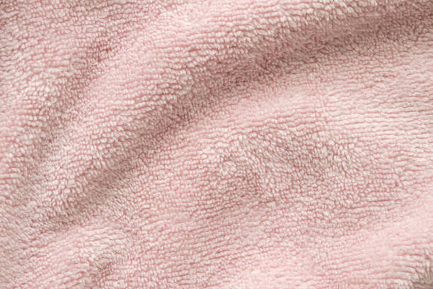 istock Pink fluffy towel fabric soft texture background 2168900505