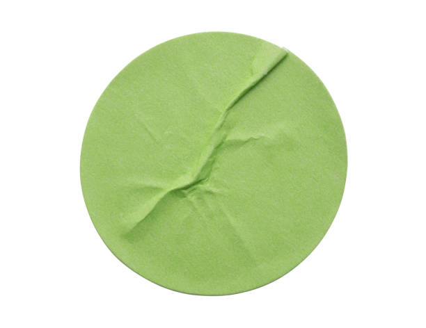 istock Blank green round adhesive paper sticker label isolated on white background 2168900574