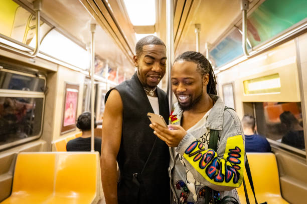 istock Black couple on New York subway using phone 2168900847