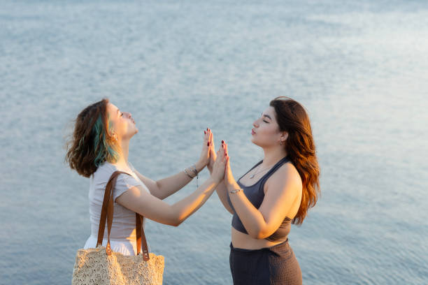 istock Cheerful young females posing on the beach 2168900949