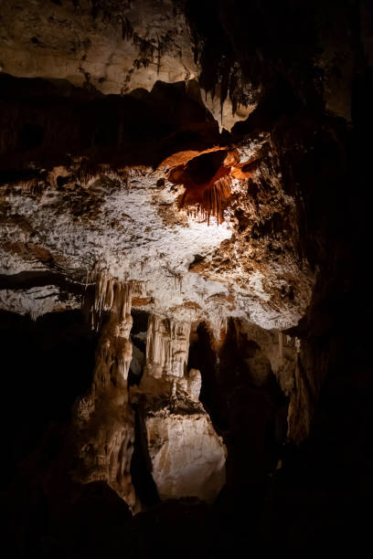 Spectacular underground limestone rock formations, lit up by lights, inside the Fig Tree Cave, part of the Wombeyan Karst Conservation Reserve in the countryside near Goulburn, NSW