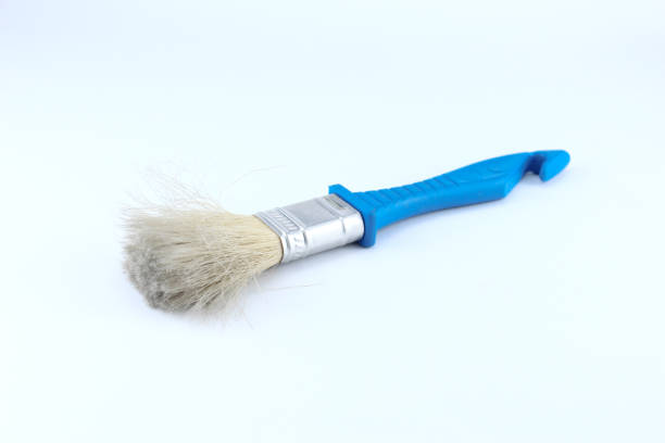 Paintbrush on green background
