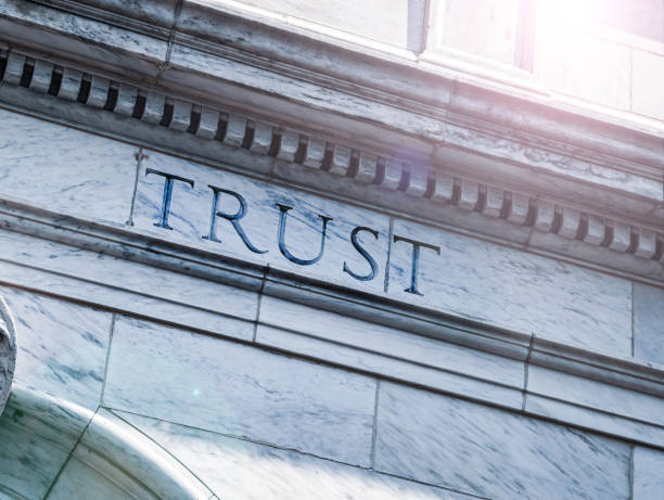 istock Trust sign on an old building 2168909340