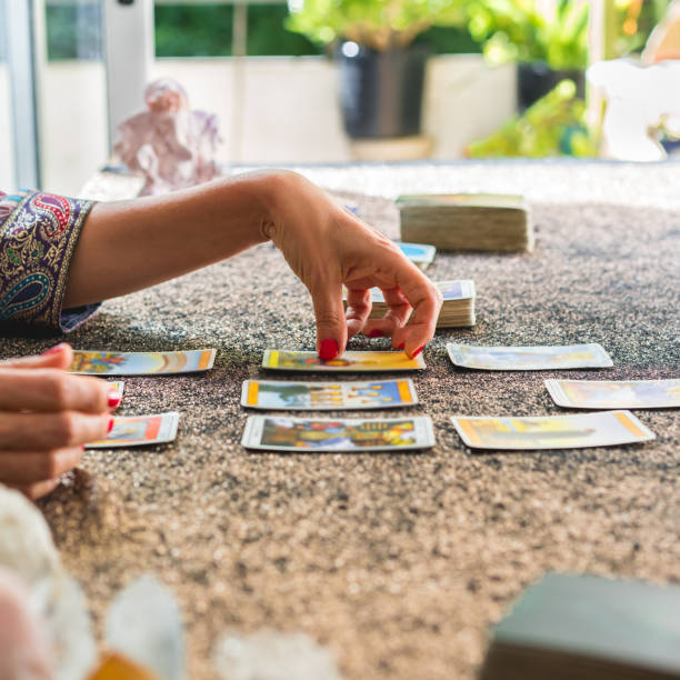 istock Side view of a tarot reader interpreting the cards 2168914431