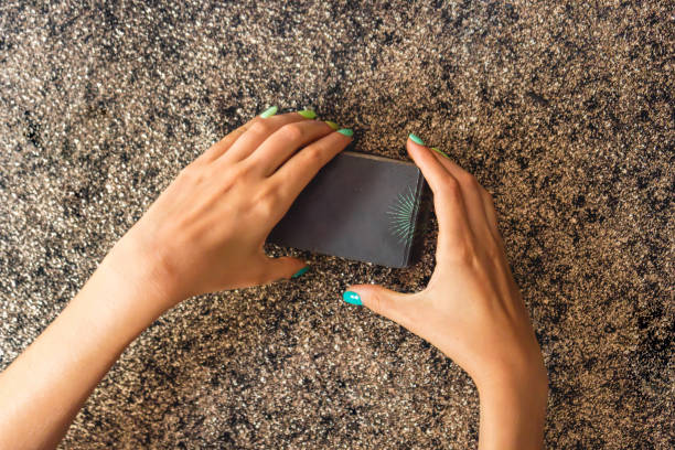 istock Top view of a client's hands cutting a tarot deck 2168914834