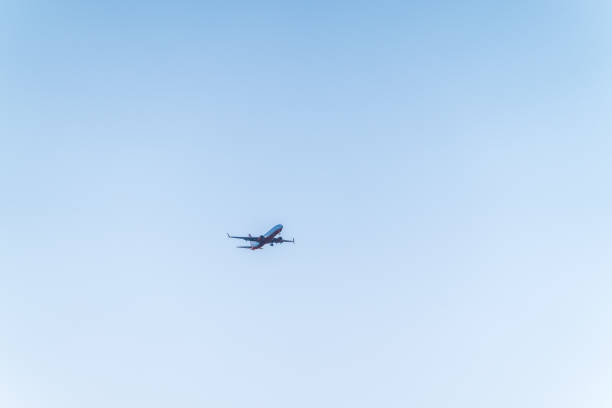 Airplane before landing in blue sky, Boeing 737-800. Air Transport. Tourism and travel concept.